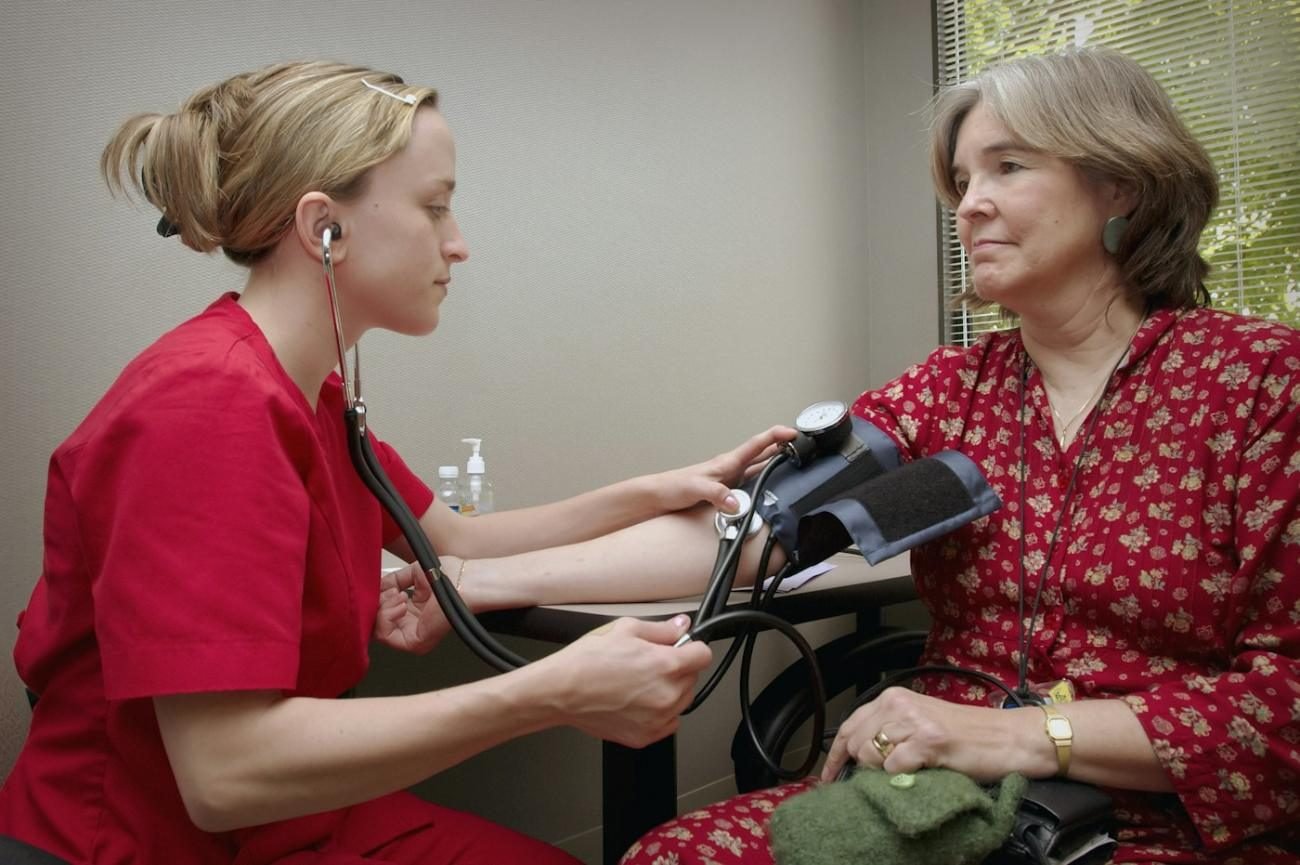 Doctor measuring a patient's blood pressure