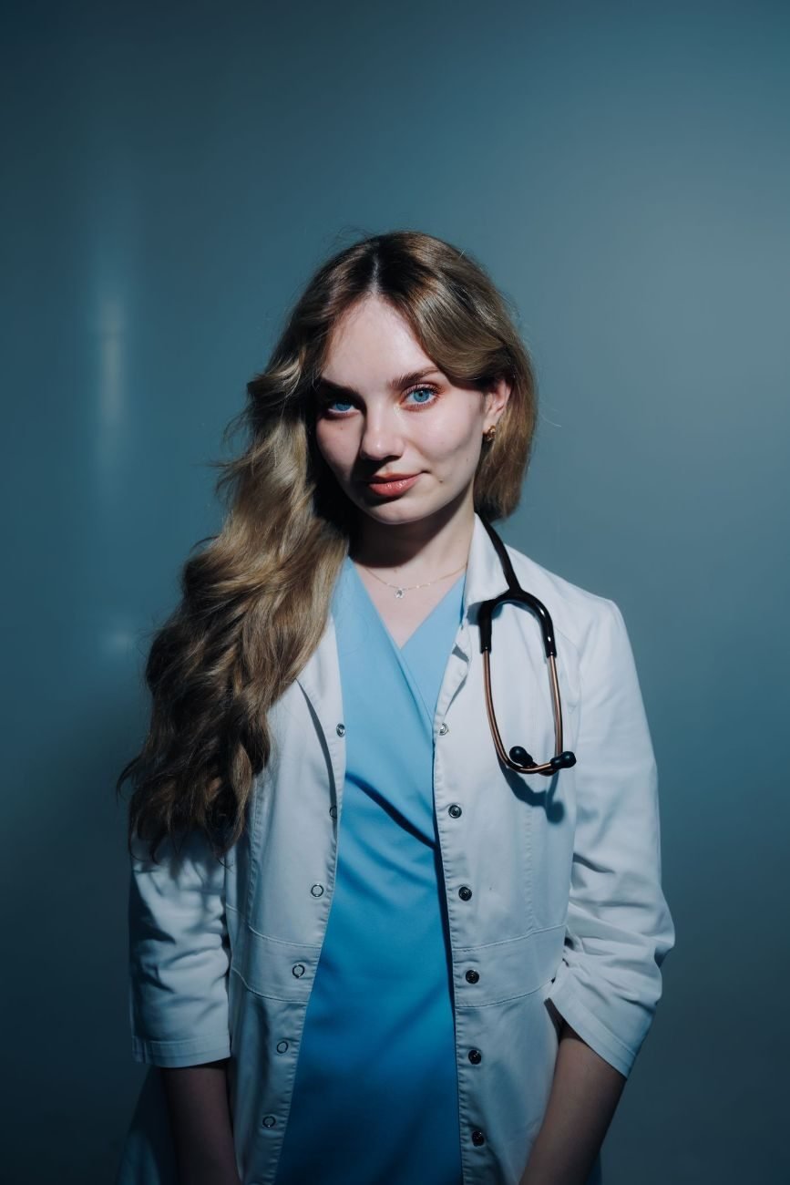 Young doctor in a white coat