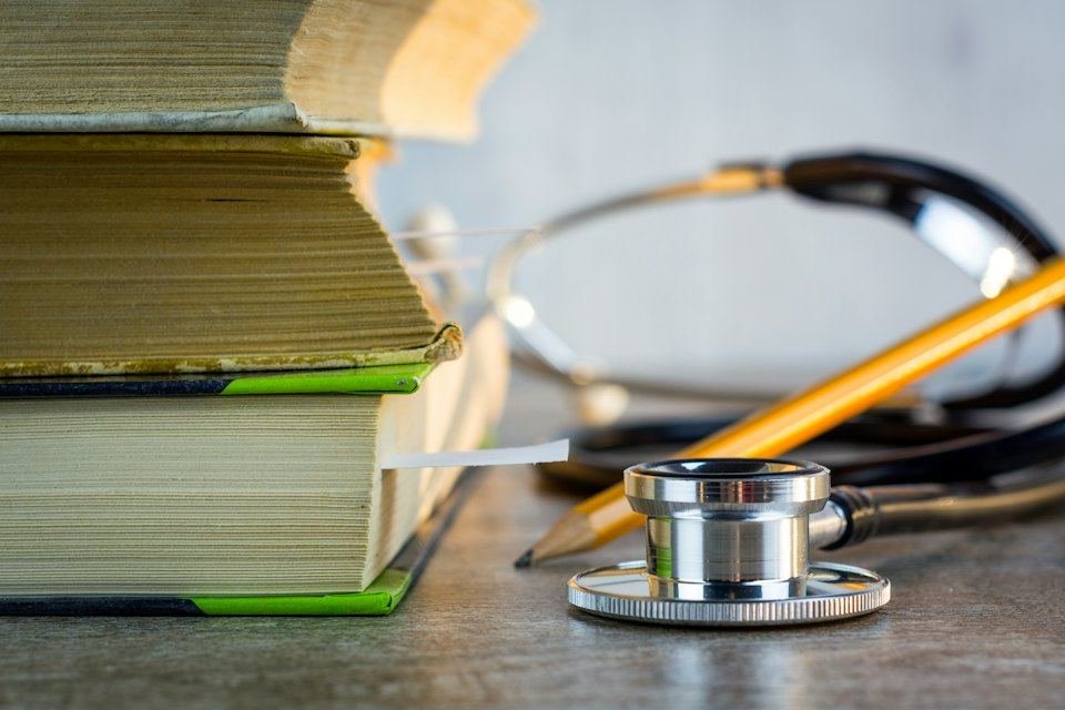 Stethoscope and medical books